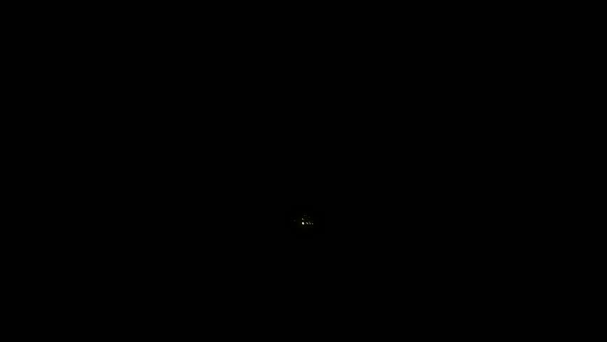 sparkling shining comet trace with glare effect. Gold glitter magic shimmer, glowing sparks and particles flare on black background. Loop animation luminous Christmas shooting star. 4k background