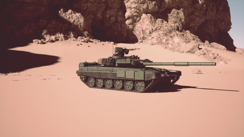 A military tank stands amidst desert sands, with rugged mountains towering in the background.