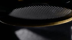 A detailed close-up of espresso dripping from a bottomless portafilter. The shot captures smooth coffee flow and rich crema in motion. - Powered by Shutterstock - Get 15% off with code: PIKWIZARD15