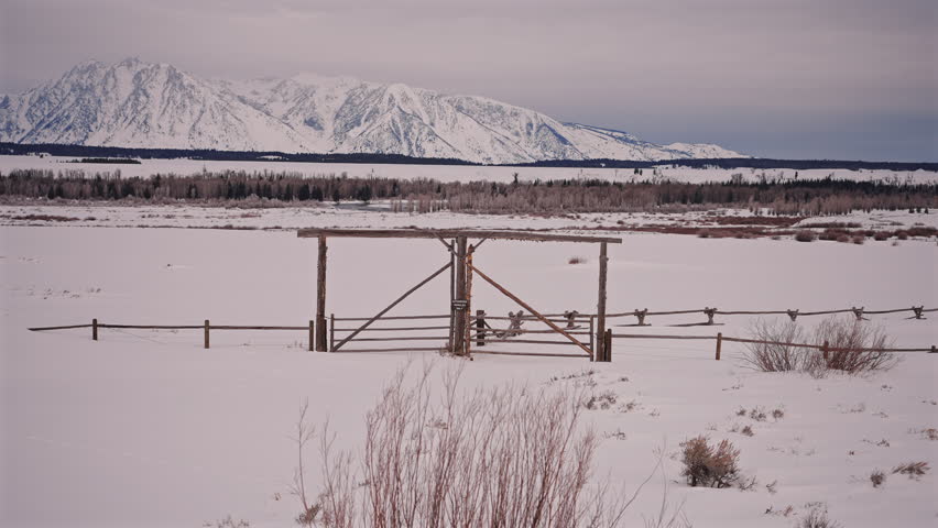 Ranch Gate With Snow and Mountain View