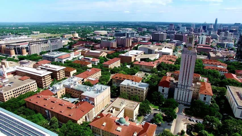 Aerial view of the university of texas campus and austin skyline