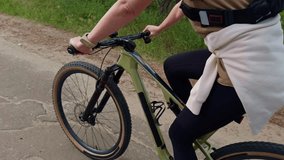 cyclist riding modern mountain bike on rural road. Healthy outdoor activity, active lifestyle, cycling gear in motion on summer day. Mountain biking cycling training. Bike travel wheel spin activity - Powered by Shutterstock - Get 15% off with code: PIKWIZARD15