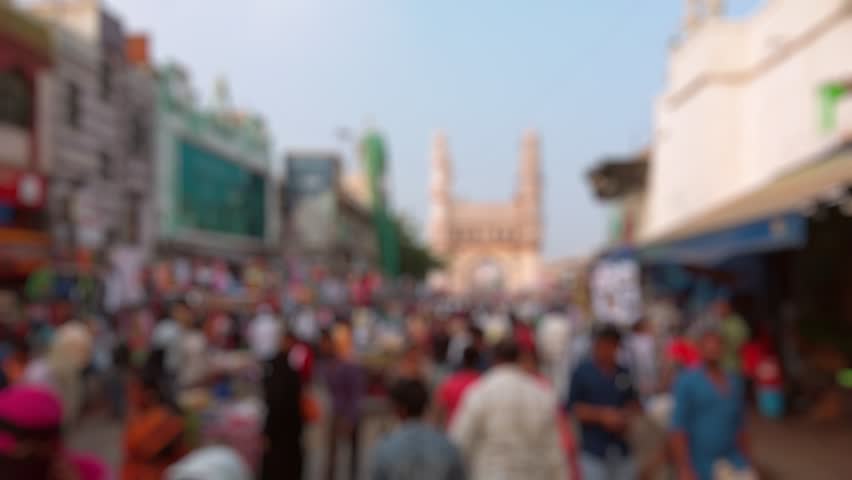 Bokeh view of people at the market street near Charminar in Hyderabad, India. Blurred background footage.