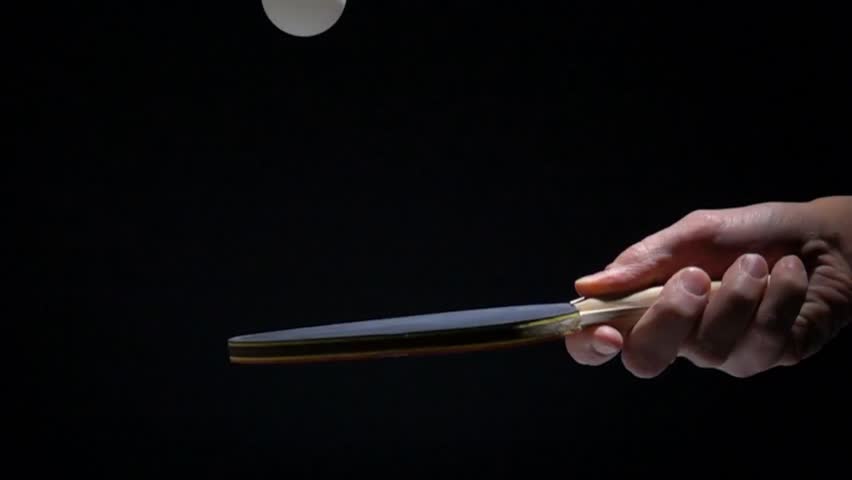 Hand Holding Table Tennis Racket And Bouncing Ping Pong Ball