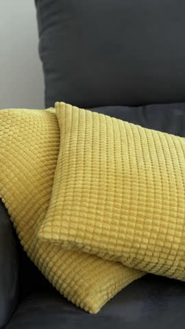Depressed man lying on the sofa and holding his head. Sad unhappy handsome caucasian man on couch having financial troubles during quarantine or suffering from loneliness.