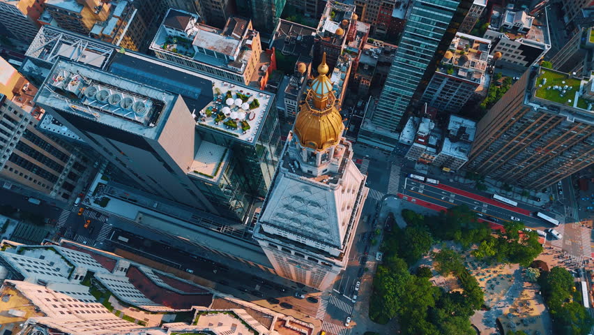 View on the pyramidal gilded roof containing a cupola and lantern. Drone flight over the clock tower of Metropolitan Life Insurance Company. New York, USA.