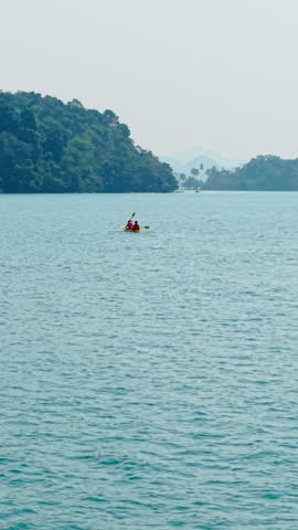 Kayak on a serene lake surrounded by lush greenery
