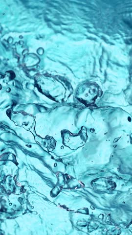Super Slow Motion of Blue Water Waves in Detail. Filmed on High Speed Cinema Camera, 1000 fps. Top Shot Composition, Vertical Aspect Ratio.