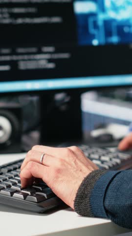 Vertical video Admin in high tech data center coding with machine learning generative AI assistant. Worker using artificial intelligence neural networks large language model technology, camera A