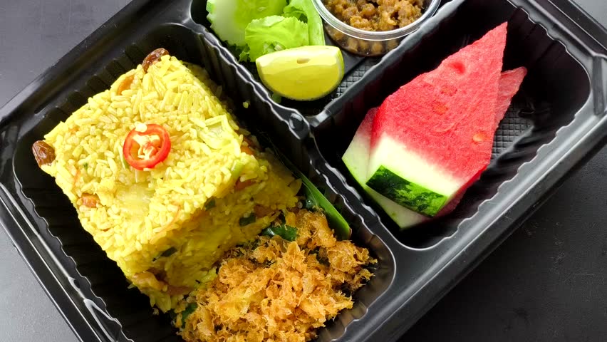  Pineapple Baked rice in plastic lunch box, indoor Chiangmai Thailand.