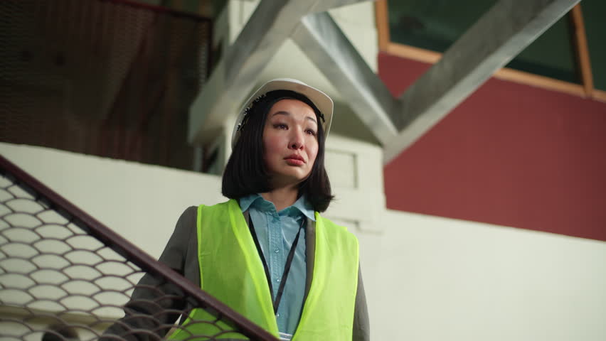 Asian Japanese builder woman businesswoman female control construction manage business Korean Chinese girl pointing professional inspector explaining working building handyman manufacturing industry