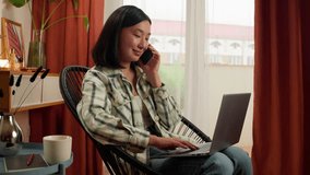 Happy Asian Korean woman talking mobile phone smartphone working typing laptop computer female entrepreneur manager call businesswoman smiling girl office home indoors consulting business freelancer - Powered by Shutterstock - Get 15% off with code: PIKWIZARD15