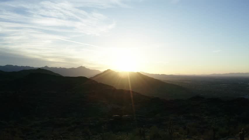 Yellow sunburst over mountains in Phoenix, Arizona.