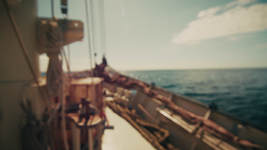 Big sailing boat moves in the open sea. Naturally blurred footage of a sailing vessel in an ocean