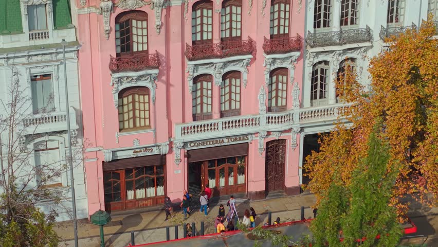 Santiago , Chile - 07 15 2025: A rose-colored house in Santiago Patrimonio, Chile, stands out for its graceful architecture and preserved charm within the historic urban landscape.