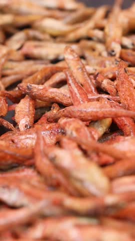 Street food small fried fish in a pan is very popular among street food. 