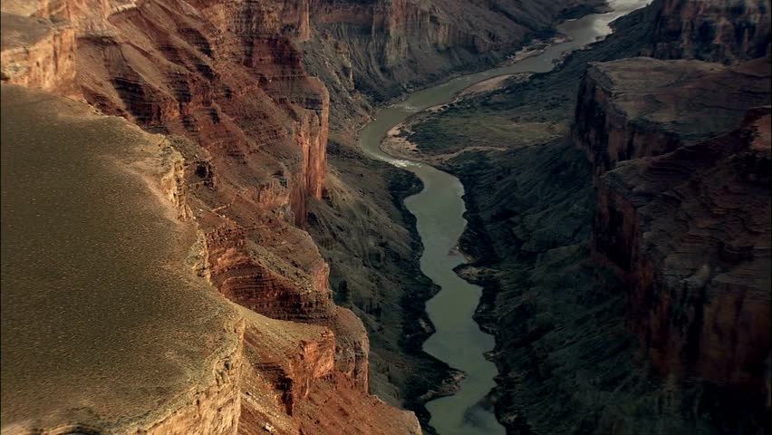 aerial drone view moving over the grand canyon formation. The Desert View Point. around United States, lands between red rocky cliffs