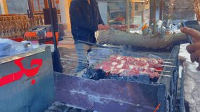 Beef kebabs getting roasted on barbeque at roadside shop in Iran. - Powered by Shutterstock - Get 15% off with code: PIKWIZARD15