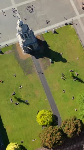 Descending social ratio aerial video of the grounds of Trinity College Dublin in Dublin City Centre, Ireland on a bright and sunny day. Filmed in 1080x1920 and with Rec709 color.