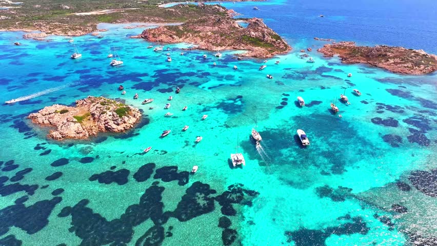 Isola Budelli. Arcipelago della Maddalena. Island Budelli. Sardinia, Italy. Beaches of Sardinia. Boats and yachts. Incredible colors and views. View from above. Drone view of Sardinia. Sea. Ocean.