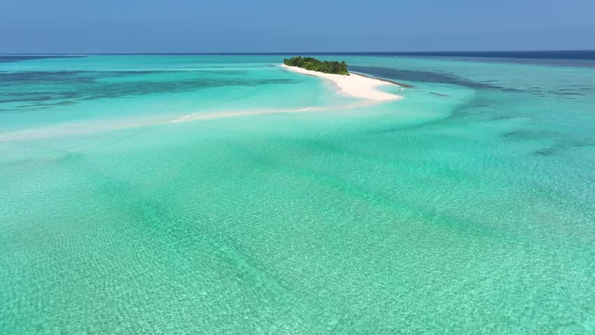 Aerial view of a pristine white sandbank curving into the turquoise waters surrounding Innafushi Island, creating a serene tropical paradise, Fulhadhoo, Baa Atoll, Maldives.