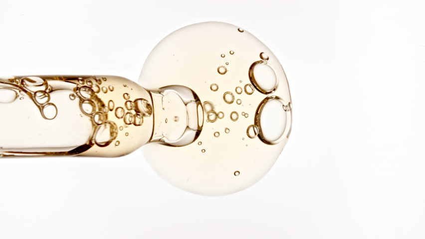 Bubble Cluster, Cells Under a Microscope From a Glass Pipette. Essential Oil, Cosmetic Serum Fluid Gel With Molecule Bubbles. Dermatology science laboratory. Macro Shot of Organic Products.
