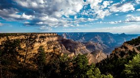 time-lapse AERIAL Grand Canyon, USA with amazing lighting, clouds, red cliffs and blue skies in 4K DCI. View over the sunny a red rock of mountain Zion - Powered by Shutterstock - Get 15% off with code: PIKWIZARD15