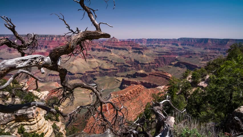 AERIAL Grand Canyon, USA with amazing lighting, clouds, red cliffs and blue skies in 4K DCI. View over the sunny a red rock of mountain Zion