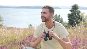 Explorer looking through his binoculars in nature  - Powered by Shutterstock - Get 15% off with code: PIKWIZARD15