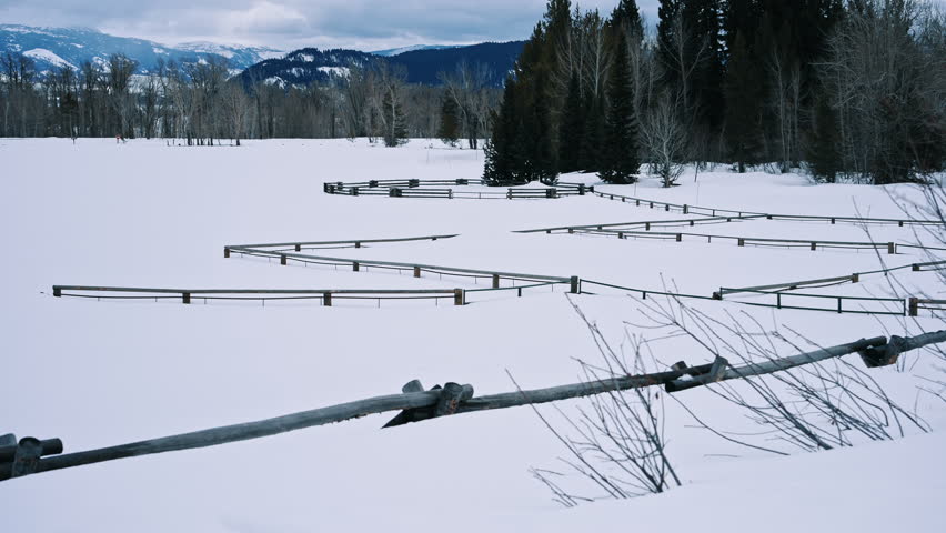 Wooden Animal Corral On Snowy Winter Field