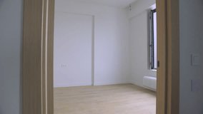 Camera Glides Through Doorway Into Bright Empty Room.
A smooth tracking shot moves through a doorway into a pristine, sunlit empty room. 4K cinematic real estate footage. - Powered by Shutterstock - Get 15% off with code: PIKWIZARD15