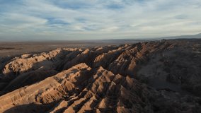 A drone view of the jagged red rock formations and expansive arid landscape in Death Valley in the Atacama Desert in Chile - Powered by Shutterstock - Get 15% off with code: PIKWIZARD15
