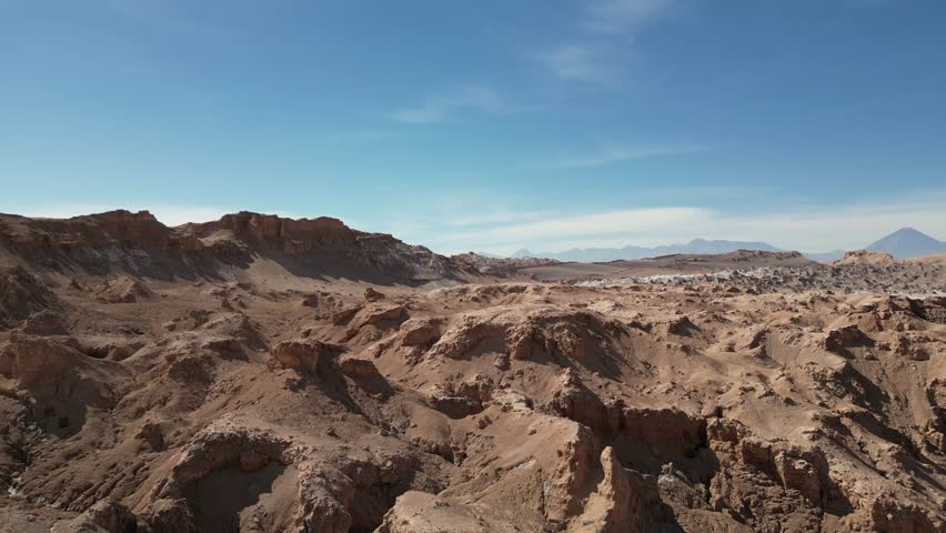 A drone view of the jagged red rock formations and expansive arid landscape in Death Valley in the Atacama Desert in Chile
