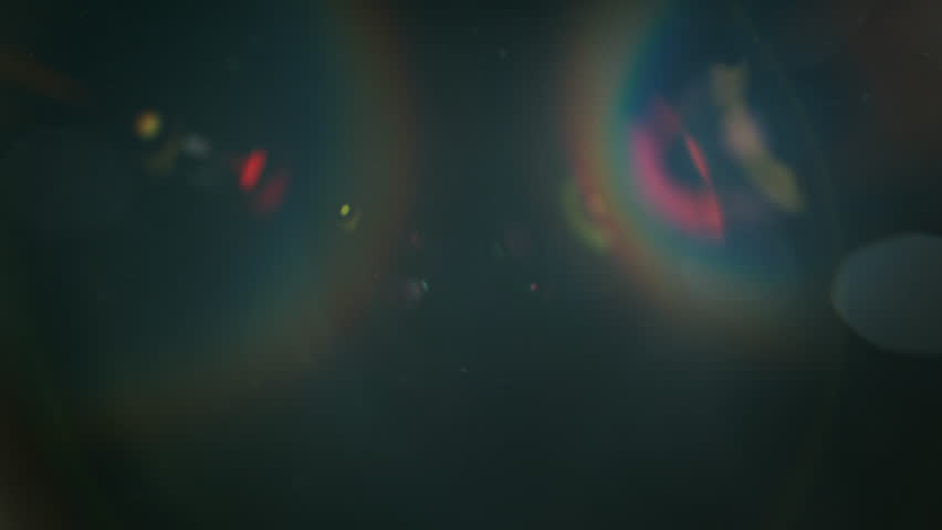Real Shooted Cinematic Lens Flare and Particle Overlay on Black Background at 1000fps Slow Motion.