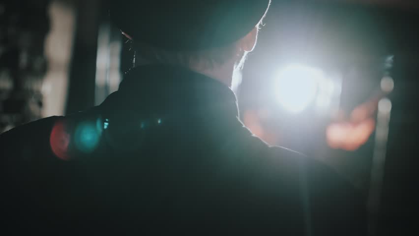 The concept of Carmen's opera. Release from prison. Portrait of a beautiful woman behind bars. A guard approaches a cell with a girl.