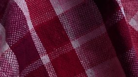 Macro shot of red and white plaid fabric. Focus on texture, weave, and color variations. Soft lighting enhances the cozy, warm feel. - Powered by Shutterstock - Get 15% off with code: PIKWIZARD15