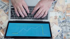 Hands over a laptop with a price chart, surrounded by dollars and euros, symbolizing financial activity. - Powered by Shutterstock - Get 15% off with code: PIKWIZARD15