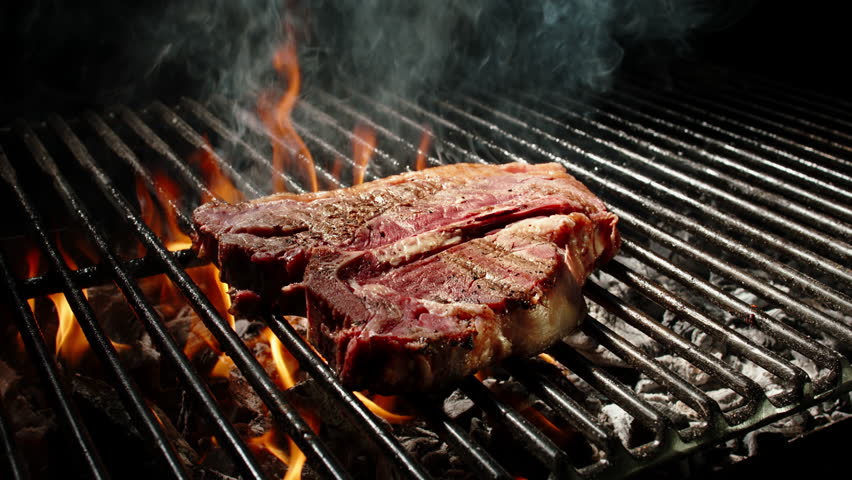 Fine Dining T-bone Steak Preparation with Herbs on Grill, 4K Slow Motion