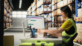 Asian staff manages awb labeling and scanning barcodes before dispatch, wearing hi vis vest in a warehouse for retail distribution. Ensuring order fulfillment and inventory tracking. Camera A. - Powered by Shutterstock - Get 15% off with code: PIKWIZARD15