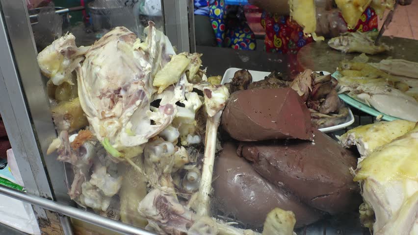 BANGKOK, THAILAND - AUGUST 2024 : View of Khao Man Gai (Chicken rice) street food stall in Yaowarat China town.