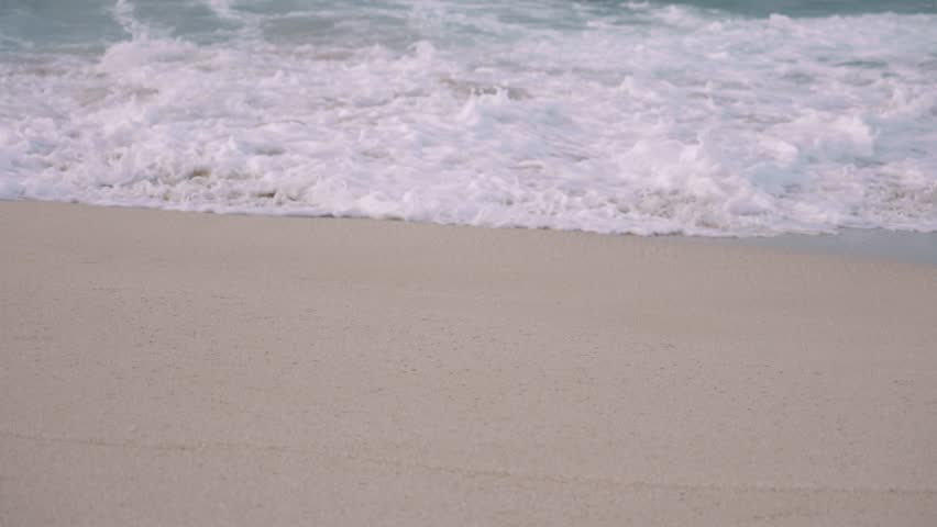 wave crashing in slow motion at north shore sunset Honolulu Hawaii