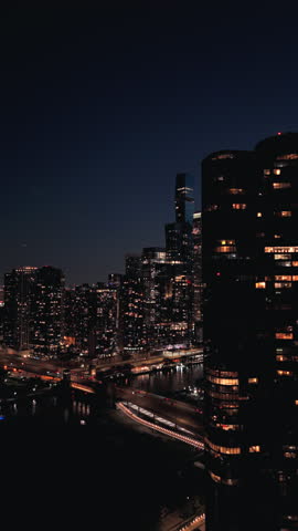 Chicago breathtaking night skyline from a drone view, featuring stunning illuminated skyscrapers and vibrant city life for a memorable exploration of this iconic metropolis
