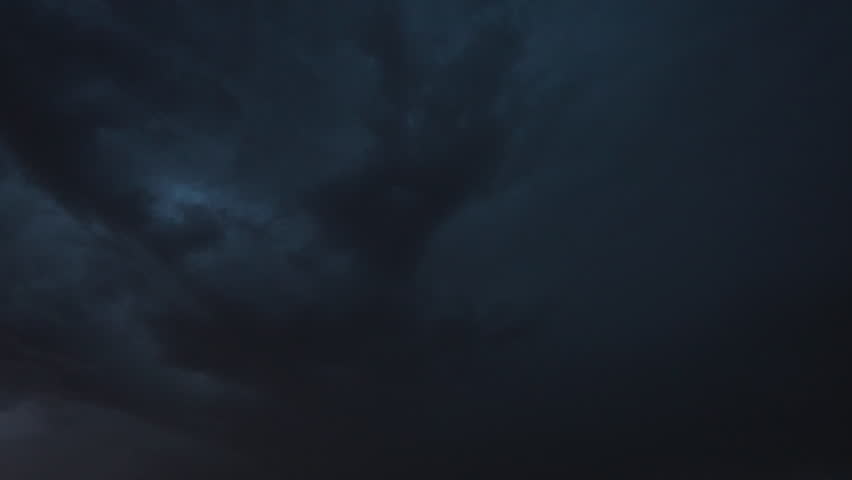Dramatic lightning bolts light up the night sky during an intense stormfront, captured on camera as electric flashes illuminate dark clouds and reveal the storm’s raw power