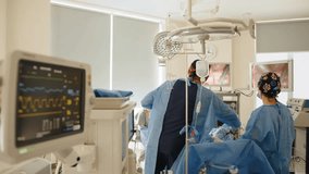 Medical team conducts a gynecological operation with laparoscopic tools, monitored via screens in a sterile operating room.
 - Powered by Shutterstock - Get 15% off with code: PIKWIZARD15