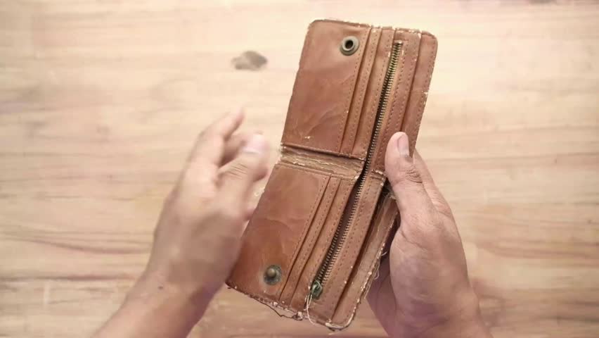 isolated background of person holding an empty wallet credit card debt expenses concept taxes bank