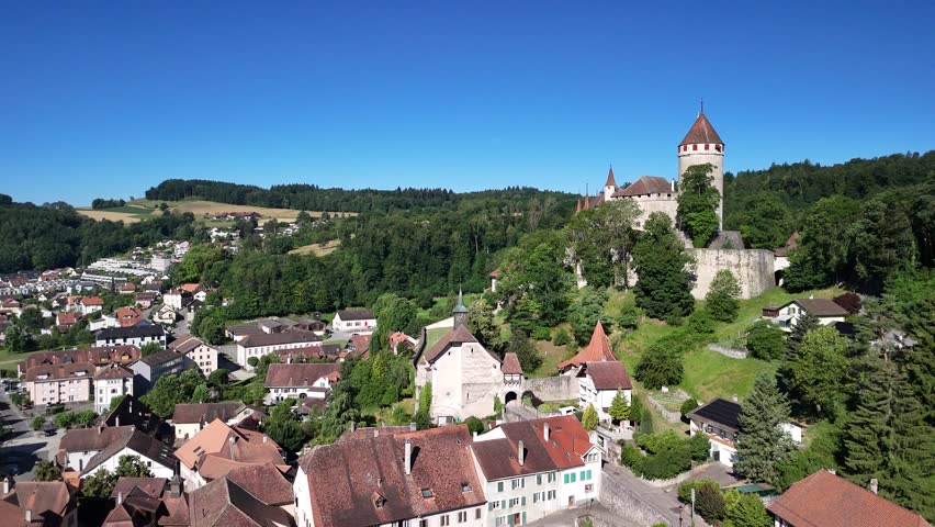 Lucens municipality Switzerland aerial drone medieval castle tower Swiss Vaud canton