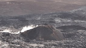 active volcanic mound releasing steam in rugged icelandic lava landscape - Powered by Shutterstock - Get 15% off with code: PIKWIZARD15