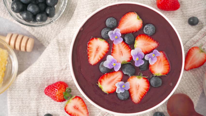 Acai bowl with strawberries and blueberries
