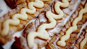 Delicious Danish pastries topped with vanilla cream and powdered sugar. Freshly baked, rich flaky layers make sweet dessert. breakfast, brunch, or bakery. Artisanal pastry craftsmanship. Baking pastry - Powered by Shutterstock - Get 15% off with code: PIKWIZARD15
