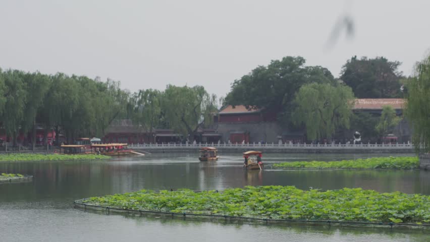 Beijing, China - june 2 2025 China traditional tourist boats on Beijing canals of Qianhai lake at ShiChaHai district 